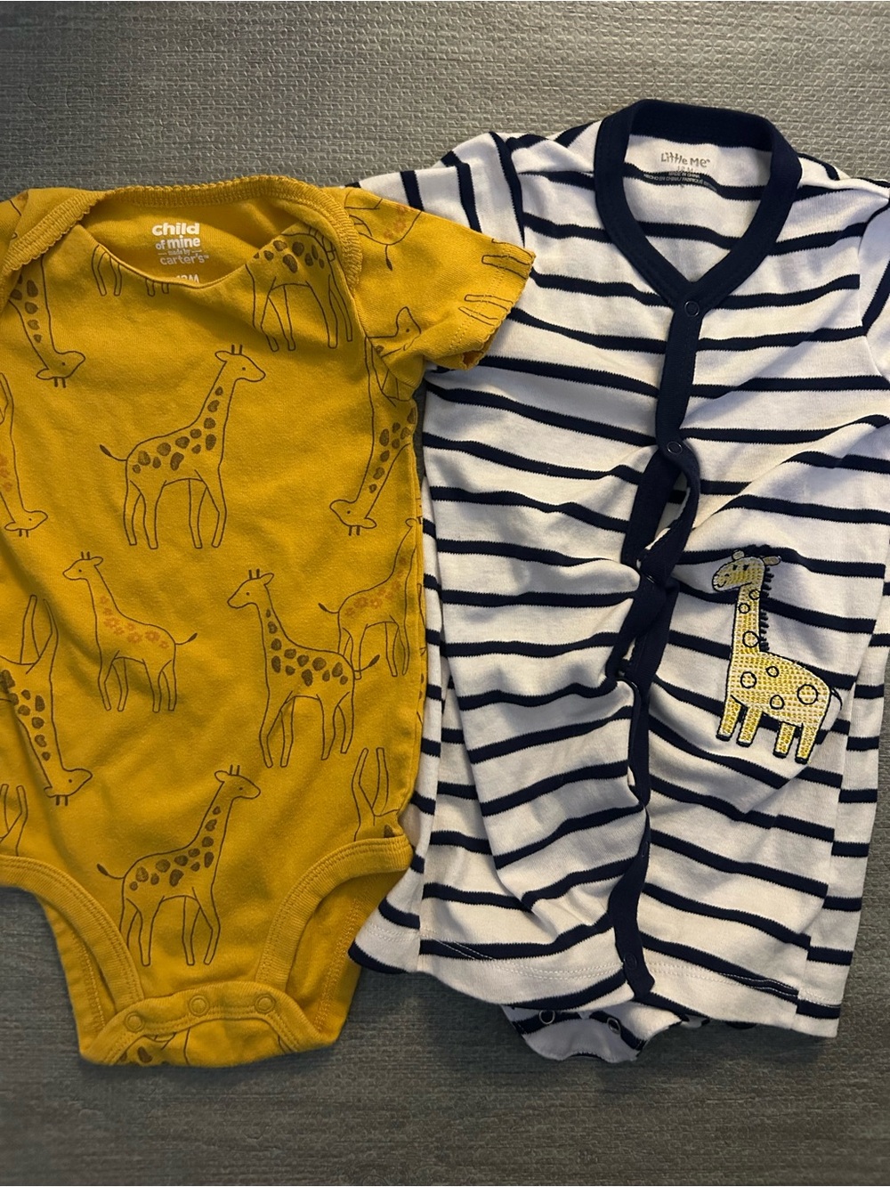 Set of 2 12M Baby giraffe onesies.
